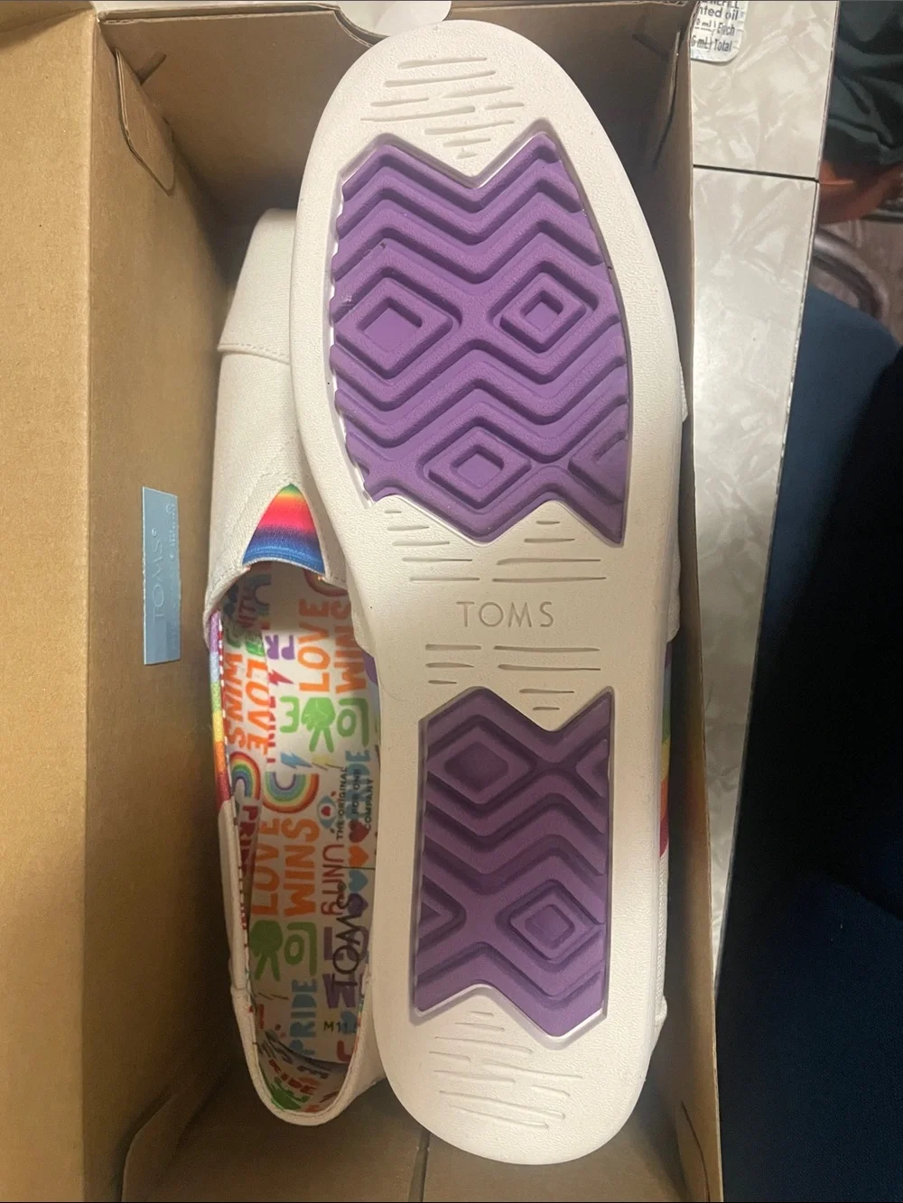 TOMS White Canvas Slip-Ons with Rainbow Stripes